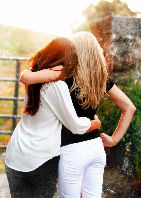 friends hugging side by side