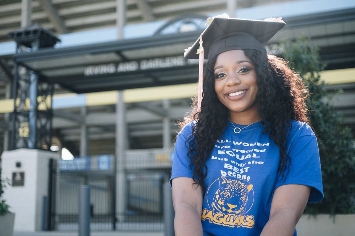 Woman Wearing Blue Shirt and graduation cap