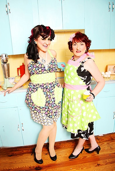 retro-inspired mother and daughter baking in kitchen