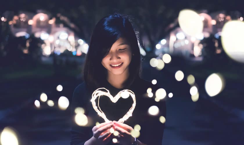 girl holding heart of light