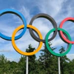 blue sky behind olympic rings