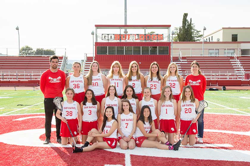 high school girls lacrosse team with coaches