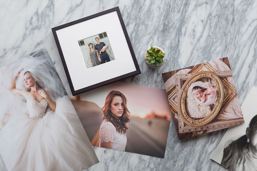 photo prints, framed print, and canvas print on marble counter