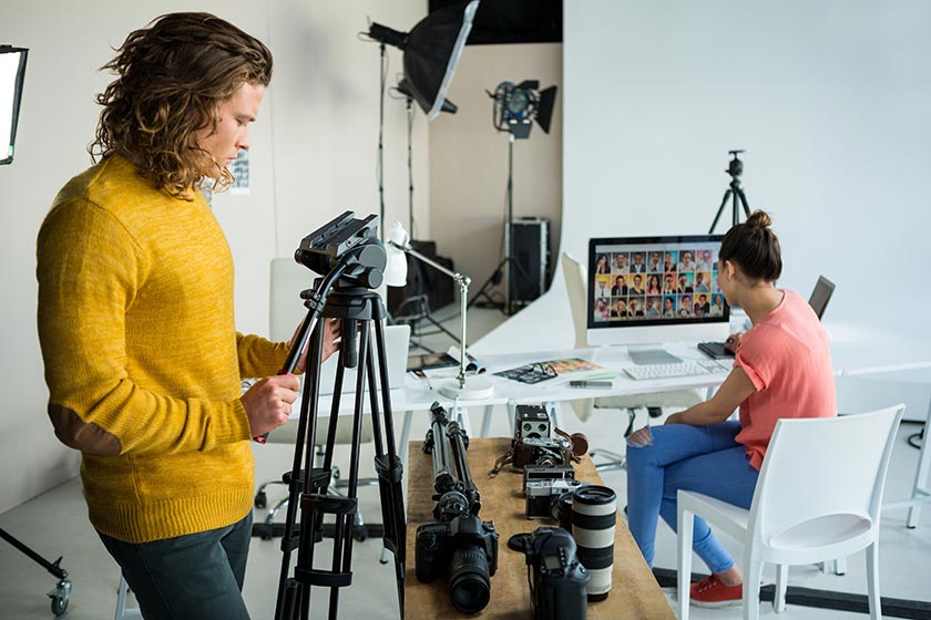 two photographers working in a large home studio