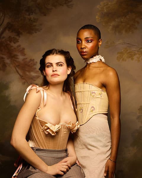renaissance inspired portrait of two women wearing corsets