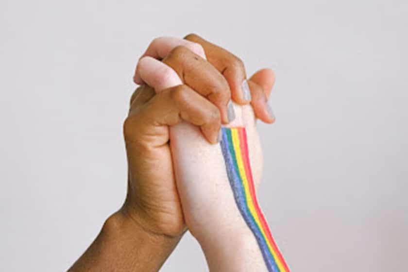 hands with rainbow colors