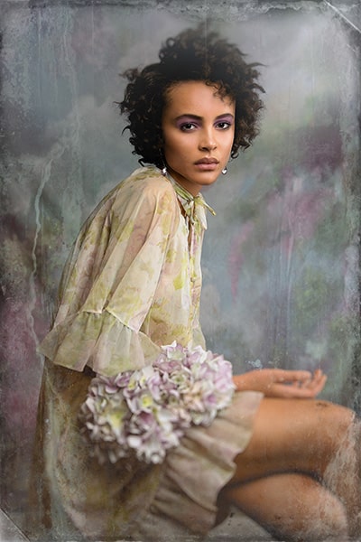 Creative portrait of black woman wearing floral chiffon dress by Lou Freeman