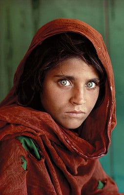 Portrait titled "Afghan Girl" photographed by Steve McCurry