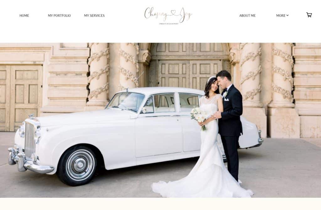 Image of wedding couple beside classic car on the Chasing Joy Photography portfolio website