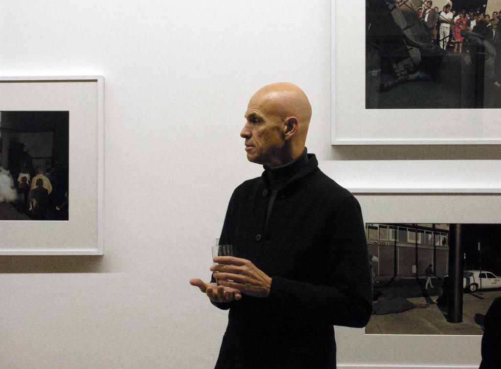 Portrait of Joel Meyerowitz at a gallery exhibit of his work
