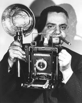 portrait of photographer Ascher (Usher) Fellig, known as Weegee, with a 4x5 medium format camera