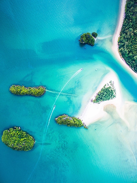 aerial landscape of islands with bright blue waters