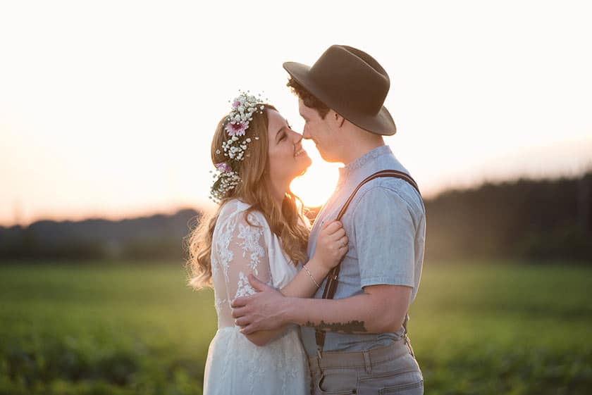 bride and groom at sunset in the countryside 