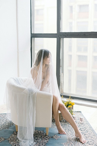 bridal boudoir image of woman under veil
