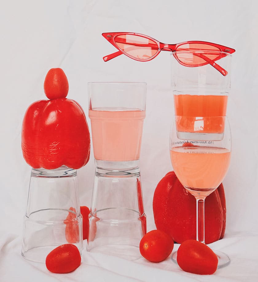 objects in pink and red in still life image