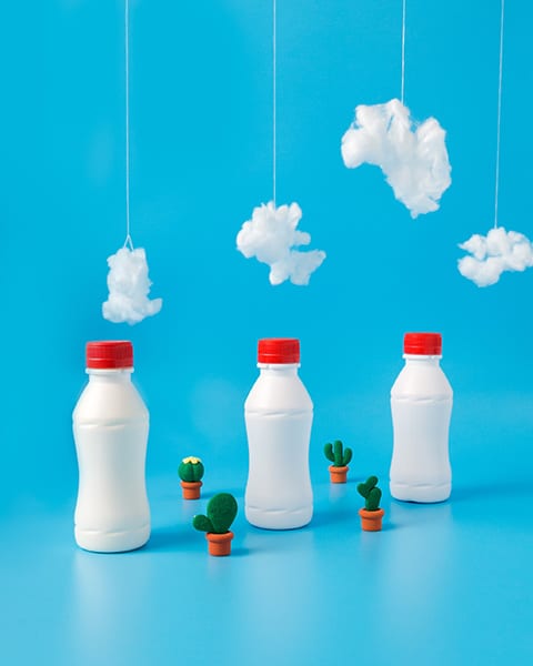 conceptual still life milk bottles 