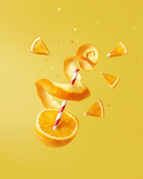 orange with a straw