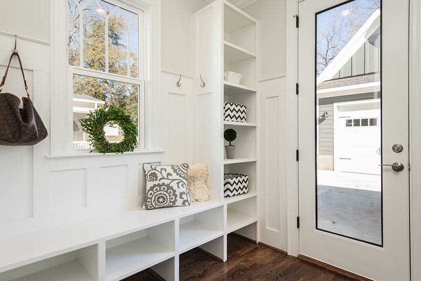 white mudroom with shelves