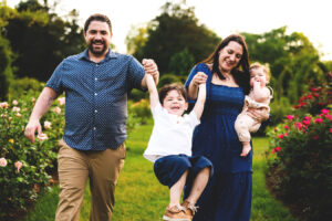parents swinging child with hands DSC 1136 Brooke Cadett