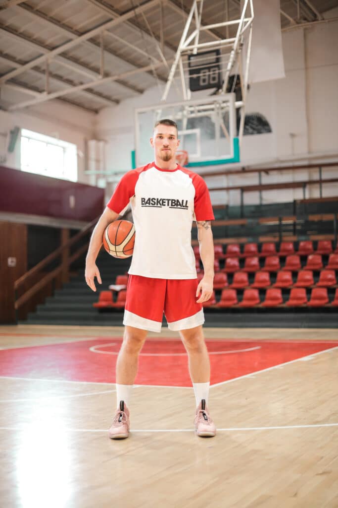 Basketball player standing on basketball court