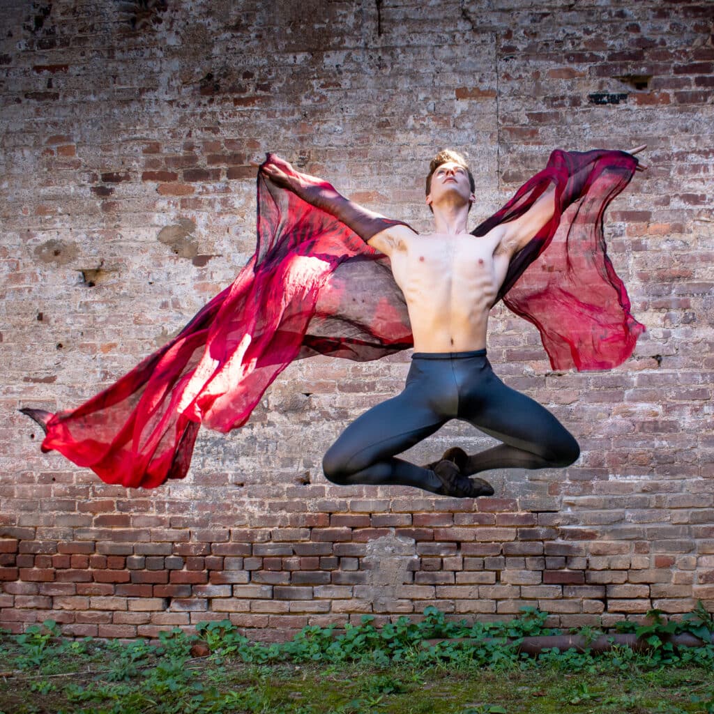 Brian Bates photograph of leaping dancer with red scarf