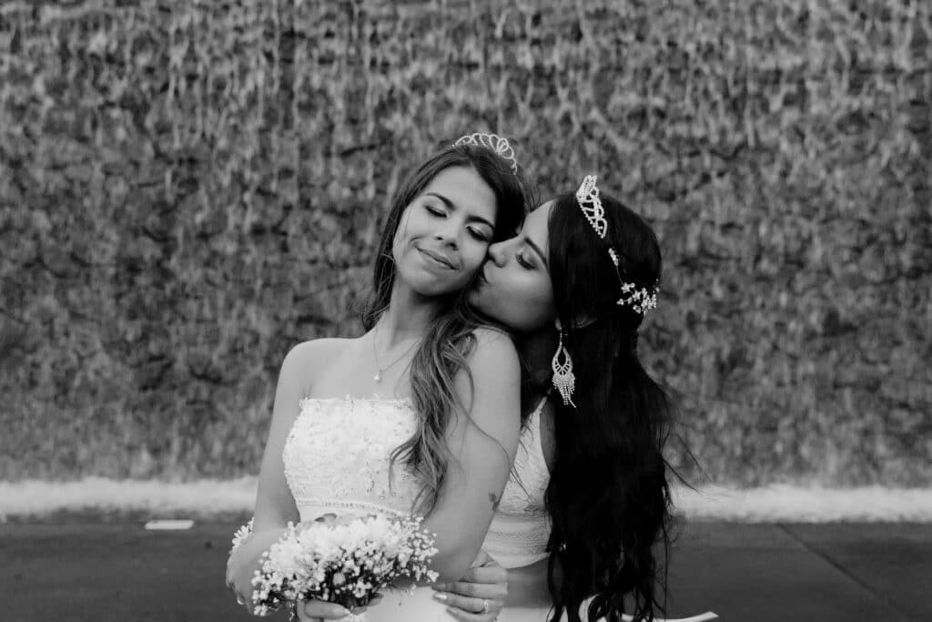 black and white two bride wedding couple hugging