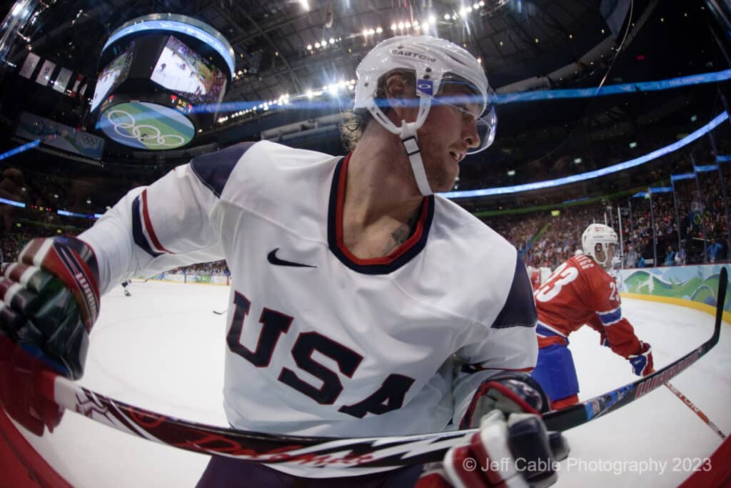Wide angle close up of USA Mens Hockey player at Olympics