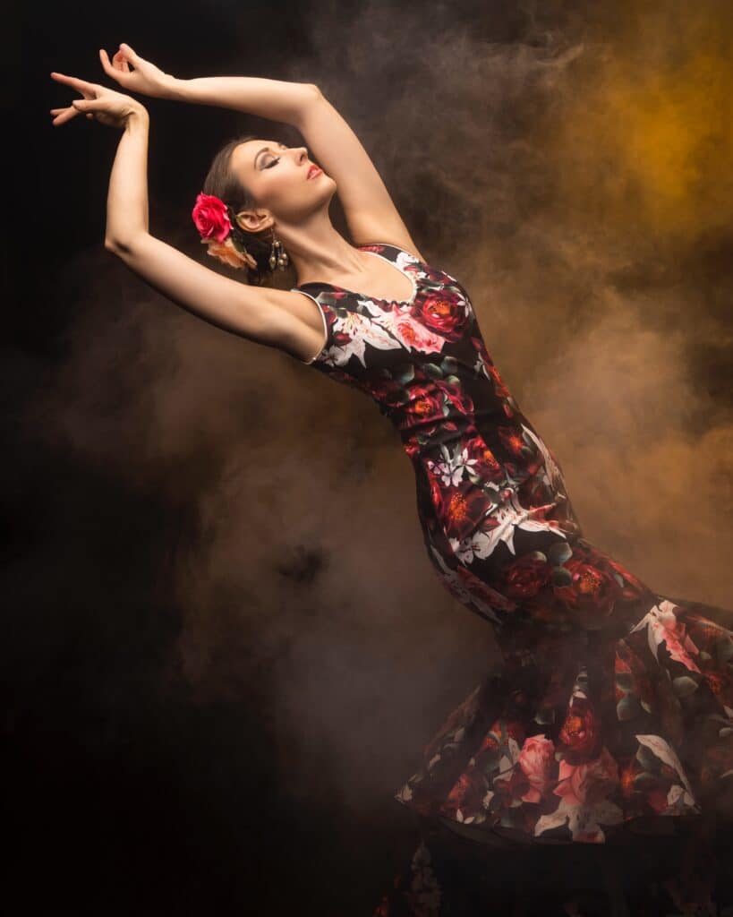 female flamenco dancer posing in fit and flare floral dress