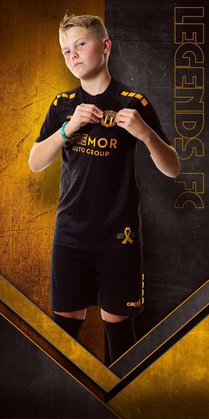 boy soccer player individual portrait with two color themed background 0304