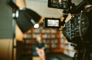 video camera recording person sitting