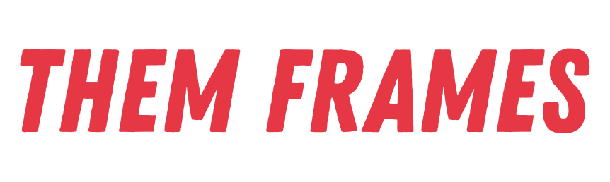 The image displays the text "THEM FRAMES" in a bold, slightly distressed red font against a black background. The text is angled slightly upwards from left to right.