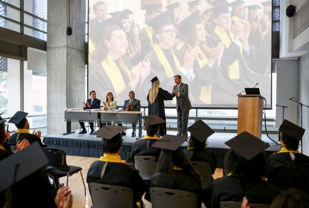graduate accepting diploma on stage
