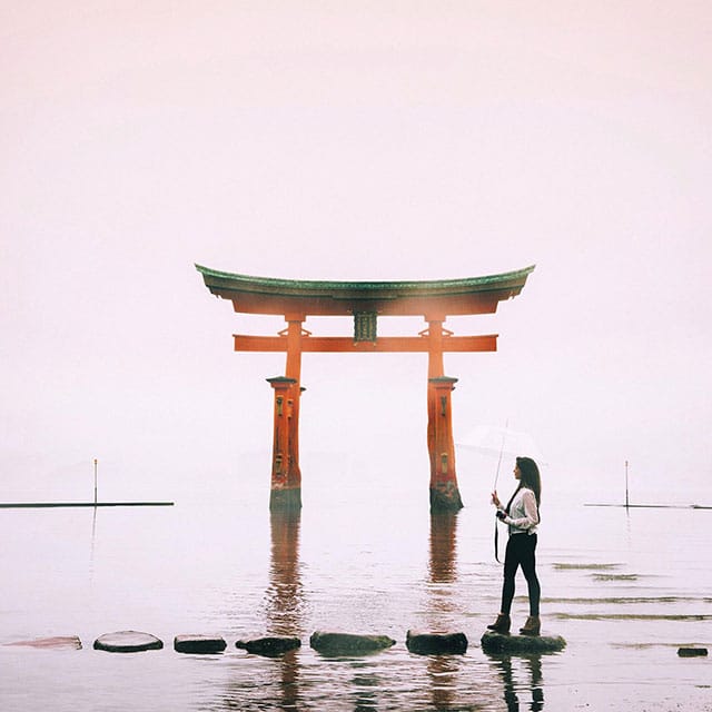 photograph of woman walking on stones in water in Japan by nastasia yakoub